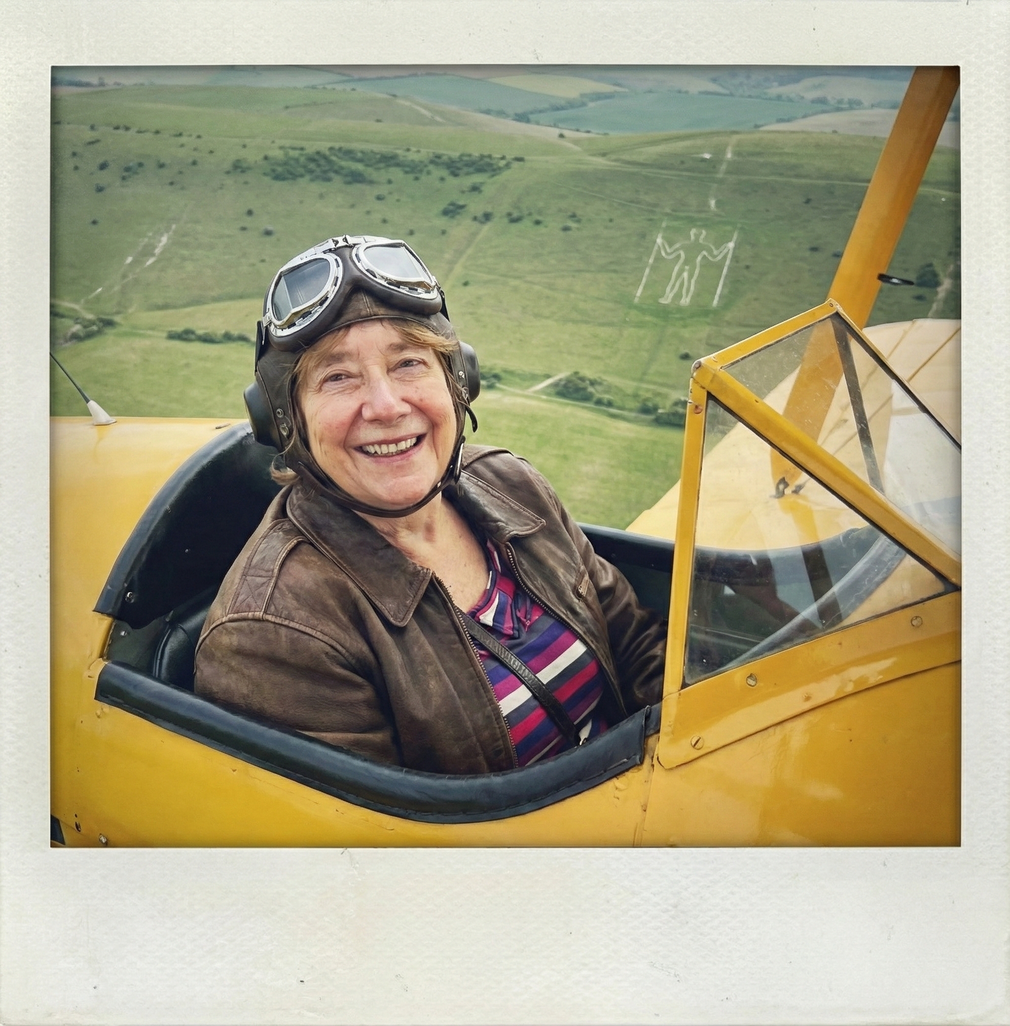 Professor Jane flying a Tiger Moth over the South Downs